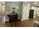 Kitchen area featuring dark wood coffee bar, stainless steel appliances, and hardwood flooring at 3 Meadowrue Ln, Youngsville, NC 27596