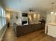 Comfortable living room featuring a fireplace, modern furnishings, hardwood floors, and lots of natural light at 3 Meadowrue Ln, Youngsville, NC 27596