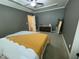 Spacious main bedroom featuring a large window, tray ceiling, and neutral decor at 3 Meadowrue Ln, Youngsville, NC 27596