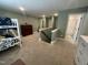 Spacious upstairs landing with multiple entryways, neutral carpet, and good lighting at 3 Meadowrue Ln, Youngsville, NC 27596