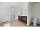 Bathroom showcasing a double vanity, glass shower doors, and wood-look flooring at , Fuquay Varina, NC 27526