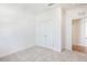 Cozy bedroom featuring neutral carpet and a double-door closet for ample storage space at , Fuquay Varina, NC 27526