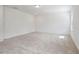 Large, empty bedroom featuring neutral carpet, natural light, and recessed lighting at , Fuquay Varina, NC 27526