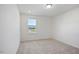 Bright bedroom with a window offering natural light and views of the surrounding neighborhood at , Fuquay Varina, NC 27526