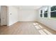 Bright living room featuring wood-look floors, natural light, and neutral paint at , Fuquay Varina, NC 27526