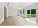 Spacious living room with wood-look floors, recessed lighting, and sliding glass doors to the backyard at , Fuquay Varina, NC 27526