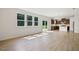 Open-concept living area showcasing wood-look floors, recessed lighting, and access to kitchen and backyard at , Fuquay Varina, NC 27526