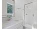 Bathroom showcasing elegant fixtures, marble countertop, and glass-enclosed tiled shower at 333 Merrywood Dr, Raleigh, NC 27610