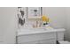 Half bath features white vanity, gold hardware, tile floors, and is perfect for guests at 333 Merrywood Dr, Raleigh, NC 27610