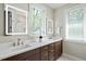 Bright bathroom showcasing double vanity, quartz countertops, and modern fixtures at 333 Merrywood Dr, Raleigh, NC 27610