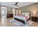 Spacious bedroom boasting hardwood floors, ceiling fan, and ensuite bath at 333 Merrywood Dr, Raleigh, NC 27610