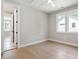 Sunlit bedroom with hardwood floors, neutral walls and modern ceiling fan at 333 Merrywood Dr, Raleigh, NC 27610
