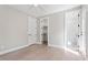 Bright bedroom featuring hardwood floors, a ceiling fan, and a walk-in closet at 333 Merrywood Dr, Raleigh, NC 27610