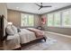 Comfortable bedroom featuring natural light, ceiling fan, and neutral tones at 333 Merrywood Dr, Raleigh, NC 27610