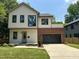 Charming two-story home with brick and modern design, complemented by a well-maintained lawn at 333 Merrywood Dr, Raleigh, NC 27610