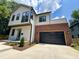 Beautiful two-story home featuring modern design elements and a brick-accented garage at 333 Merrywood Dr, Raleigh, NC 27610