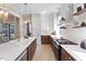 Bright, open kitchen featuring a large island, modern appliances, and natural light at 333 Merrywood Dr, Raleigh, NC 27610