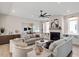 Bright living room featuring hardwood floors, neutral furniture, and a cozy fireplace at 333 Merrywood Dr, Raleigh, NC 27610