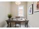 Bright office space featuring a modern desk, hardwood floors, neutral paint, and a large window at 333 Merrywood Dr, Raleigh, NC 27610