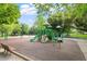 The Roberts Park playground includes slides, swings and climbing structures at 333 Merrywood Dr, Raleigh, NC 27610