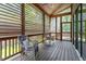 Covered outdoor porch area with comfortable seating and wooded views at 333 Merrywood Dr, Raleigh, NC 27610