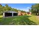 Large backyard with a detached garage, a brick house, and plenty of green space at 3701 Oak Grove Church Rd, Mebane, NC 27302