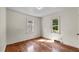 Bedroom with hardwood floors, natural lighting and views of the yard at 3701 Oak Grove Church Rd, Mebane, NC 27302
