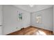 Bedroom with hardwood floors, natural lighting, and neutral paint at 3701 Oak Grove Church Rd, Mebane, NC 27302