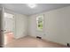 Bedroom with neutral walls, carpet floors, and window with natural light at 3701 Oak Grove Church Rd, Mebane, NC 27302