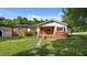 Charming brick home with a well-manicured lawn and inviting front porch at 3701 Oak Grove Church Rd, Mebane, NC 27302