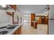 Open kitchen area features vintage stove top, cabinetry, and natural lighting at 3701 Oak Grove Church Rd, Mebane, NC 27302