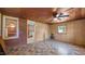 Spacious living room with brick exterior, ceiling fan, and natural light at 3701 Oak Grove Church Rd, Mebane, NC 27302