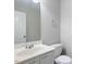 This bathroom has a large mirror, a white toilet, and a vanity cabinet with a sink at 3814 Tyler Bluff Ln, Raleigh, NC 27616
