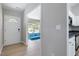 Inviting entryway boasting wood floors and leading to a living room with a blue couch at 3814 Tyler Bluff Ln, Raleigh, NC 27616