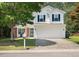 Charming two-story home with attached two car garage and attractive landscaping at 3814 Tyler Bluff Ln, Raleigh, NC 27616