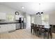 Bright eat-in kitchen with stainless steel appliances and white cabinetry at 3814 Tyler Bluff Ln, Raleigh, NC 27616