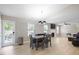 Open-concept living area with fireplace, modern lighting, and access to the backyard at 3814 Tyler Bluff Ln, Raleigh, NC 27616