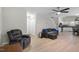 Living room with luxury vinyl floors, neutral paint, and an open floor plan at 3814 Tyler Bluff Ln, Raleigh, NC 27616