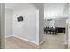 Open concept living room with wood floors flows into the dining room at 3814 Tyler Bluff Ln, Raleigh, NC 27616