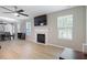 Modern living room with sleek fireplace, luxury vinyl flooring, and comfortable seating at 3814 Tyler Bluff Ln, Raleigh, NC 27616