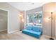 Cozy living room featuring a blue couch and a bright window view at 3814 Tyler Bluff Ln, Raleigh, NC 27616
