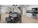 Spacious open-concept living space leading to the kitchen and upstairs at 3814 Tyler Bluff Ln, Raleigh, NC 27616