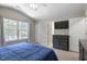 Main bedroom featuring large windows and a flat screen TV at 3814 Tyler Bluff Ln, Raleigh, NC 27616