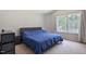 Main bedroom with ample natural light and a view to the backyard at 3814 Tyler Bluff Ln, Raleigh, NC 27616
