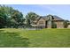 Spacious backyard featuring a private swimming pool surrounded by a secure fence and mature trees at 39 Wood Stork Ct, Clayton, NC 27520