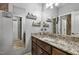 Bathroom with granite countertop, decorative shelves, and access to the shower at 39 Wood Stork Ct, Clayton, NC 27520