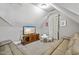 Neutral bedroom features cozy seating, a television, and a vaulted ceiling at 39 Wood Stork Ct, Clayton, NC 27520