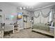 Cozy bedroom featuring stylish decor, a workstation, and warm carpet flooring at 39 Wood Stork Ct, Clayton, NC 27520