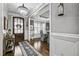 Elegant foyer with hardwood floors, stylish rug, and chandelier, creating a grand entrance at 39 Wood Stork Ct, Clayton, NC 27520
