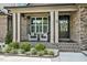 Inviting front porch with seating, decorative plants, and a charming entryway for a welcoming ambiance at 39 Wood Stork Ct, Clayton, NC 27520